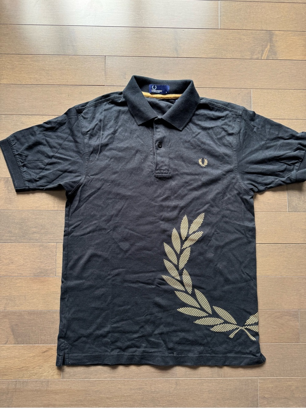 Fred Perry Vintage Black Polo Shirt with Gold Laurel Graphic | Size Small